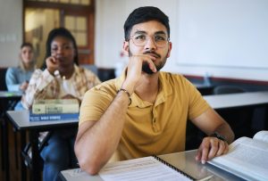 Arab man, university student and studying law for a class project with legal paper, contract docume