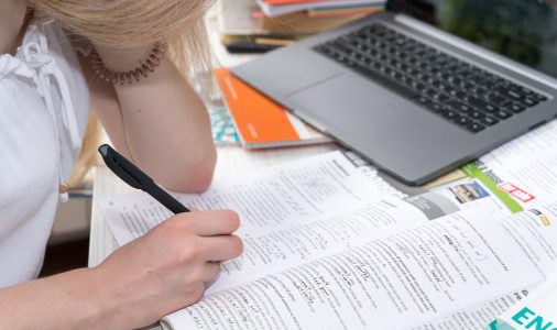 girl doing homework in english