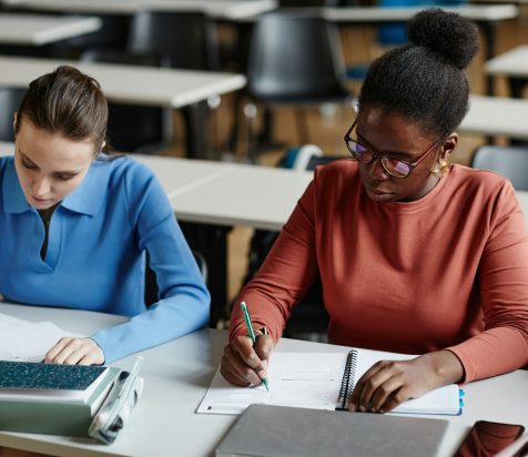 Students Taking Exam in School Closeup